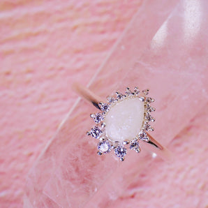 breastmilk ring centre with genuine white diamonds in pear shape 
