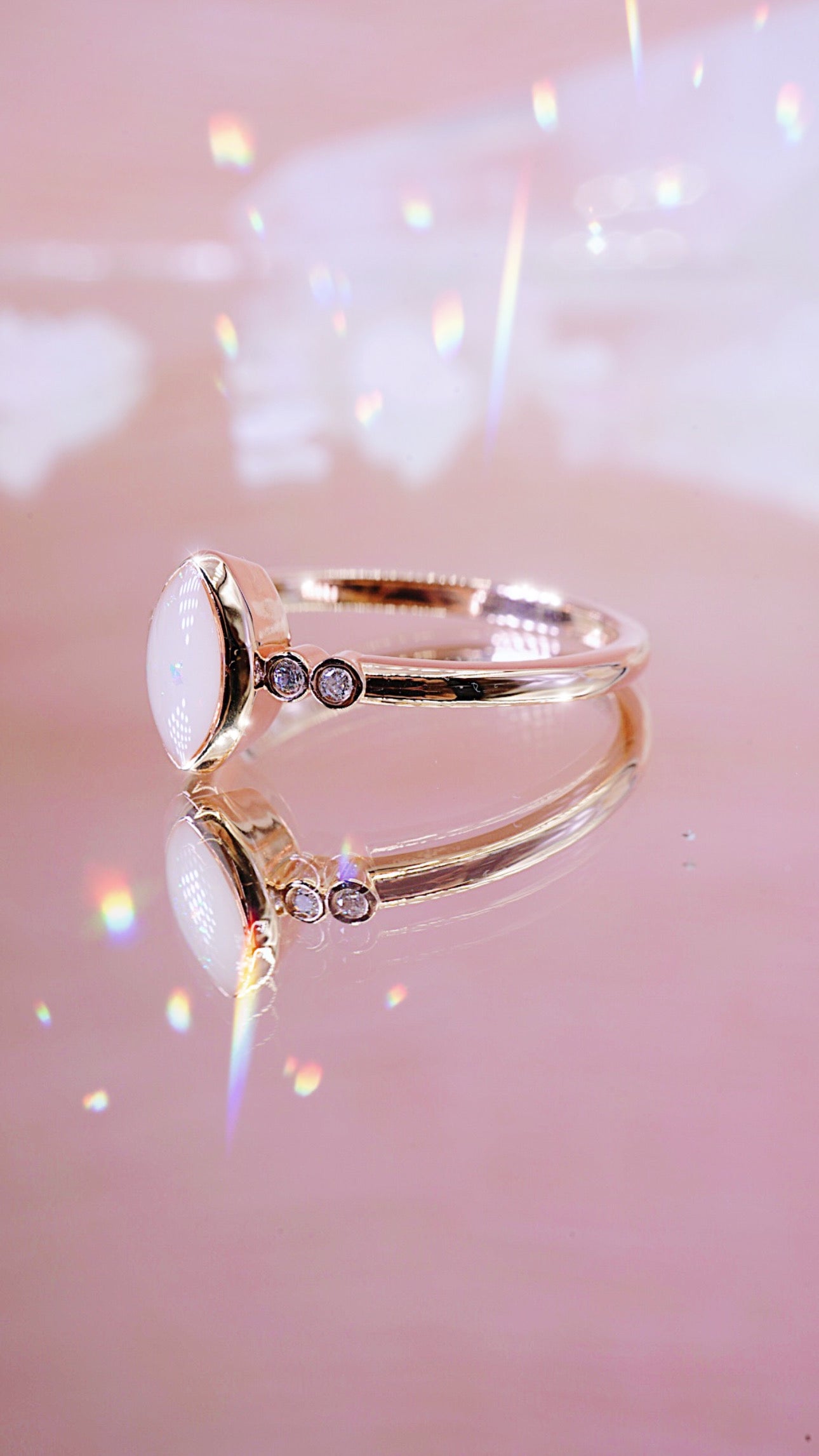 Solid gold ring with breastmilk stone centre and 2 diamonds each side 