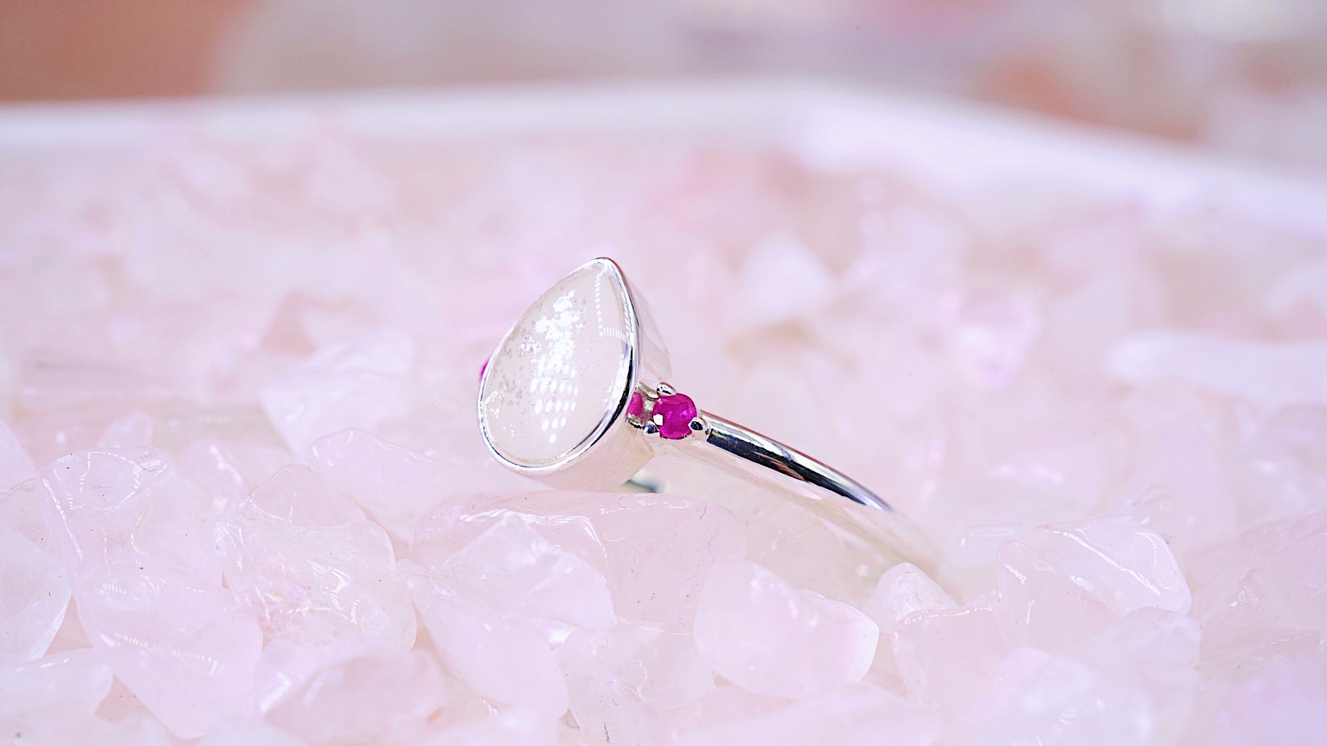 Pear shape ring with breastmilk stone and pink rubies 