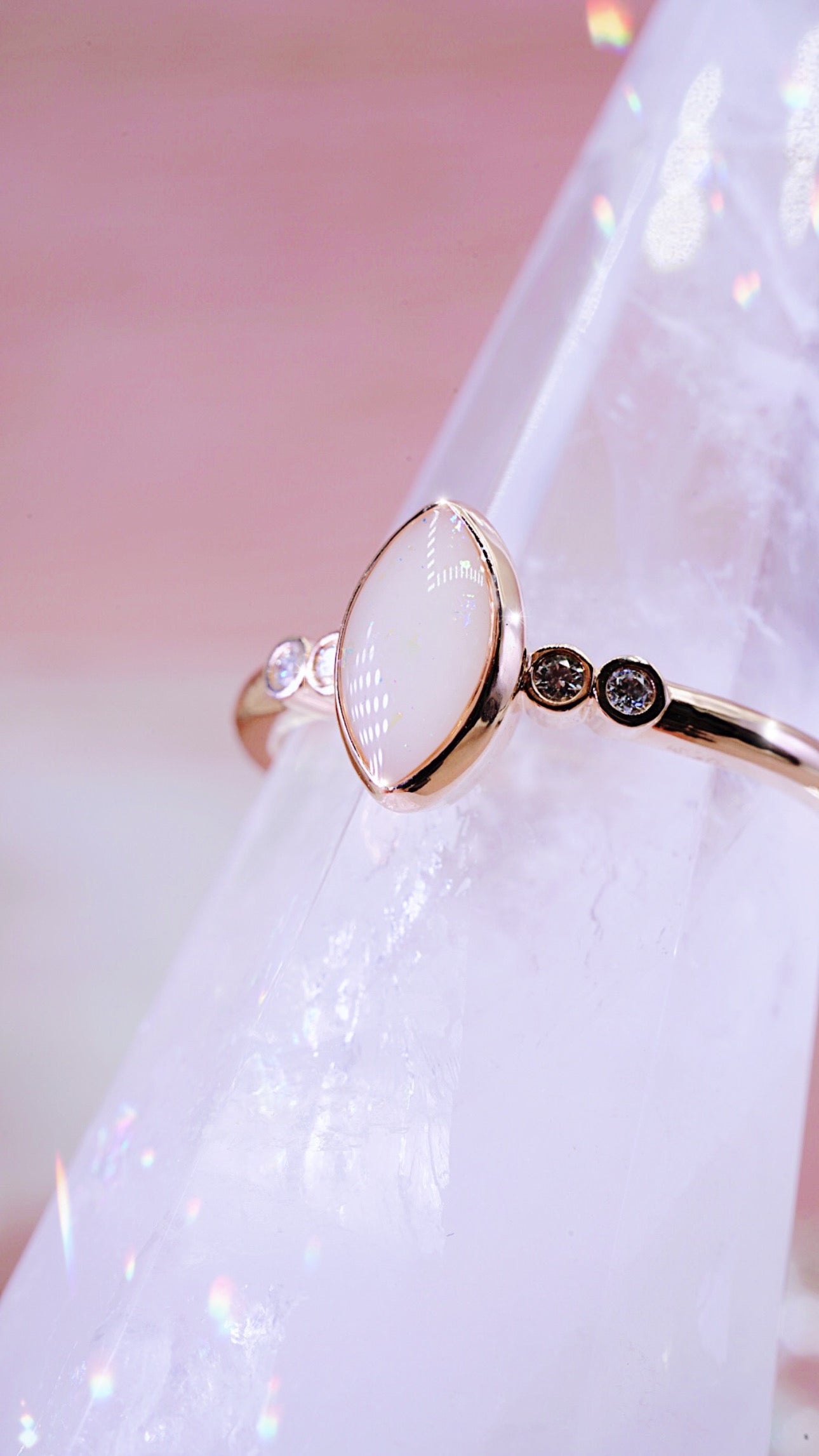 Solid gold ring with breastmilk stone centre and 2 diamonds each side 