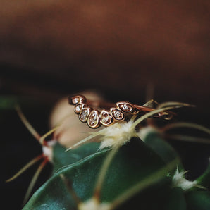 ring band with 3 inclusion stones and 4 diamonds