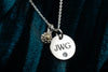 engraved disk with cremation ashes charm on chain